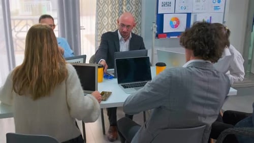 Team Working Together at Office Conference Table
