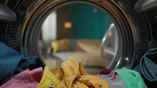 View From Inside the Washing Machine with an Opened Door Into the Living Room Slow Motion