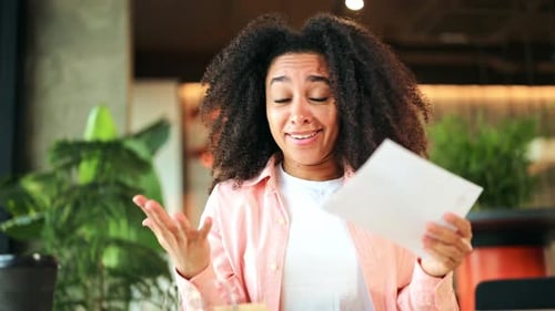 Woman Reads Good News With Joy