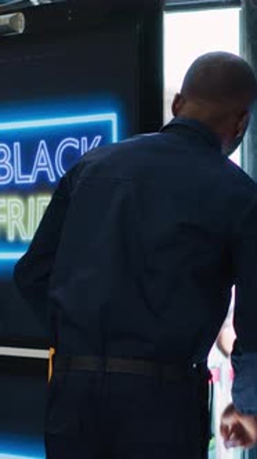 Vertical Video Security Officer Gives Access in Store