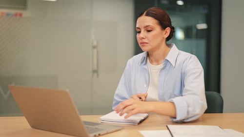 Diligent Businesswoman Engaged in Productive Office Work