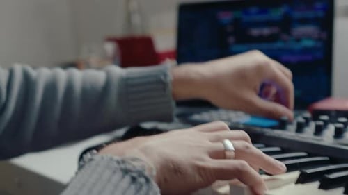 Musician Creating Music on Keyboard at Home