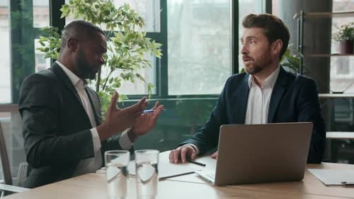 Two Diverse Business Men Team Multiracial Businessmen Emotional Talking Discuss Problem Negotiation