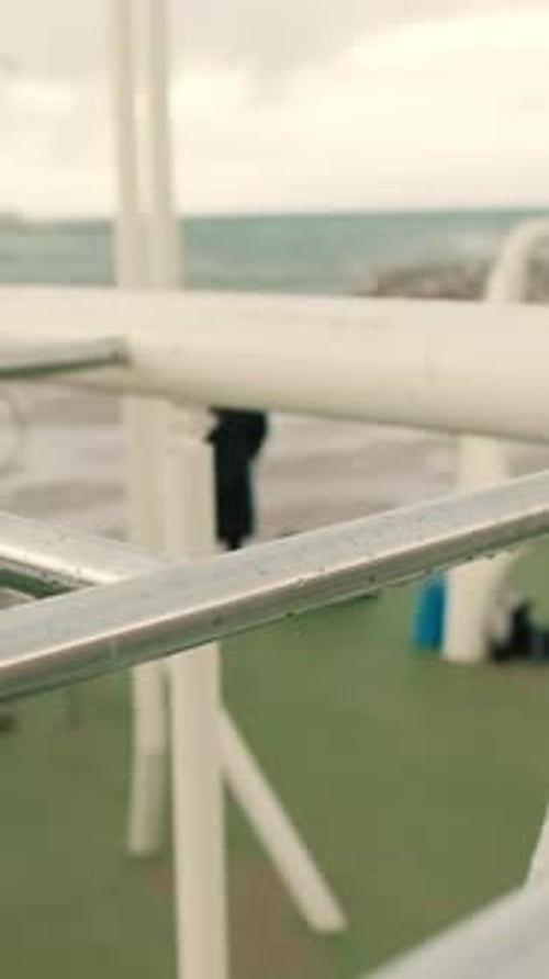 Close-up of doing pull-ups on a horizontal bar outdoors