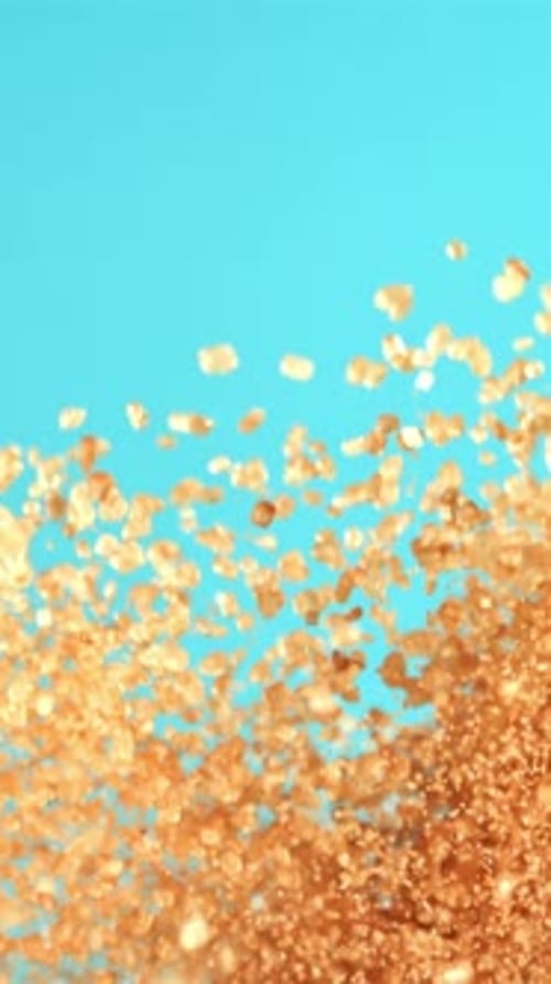 Cane Sugar Soars Against a Blue Background Filmed on a Highspeed Camera at 1000 Fps