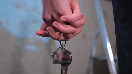 Own Home Mortgage Relocation Concept Couple Hands Holding Key From New First House Family