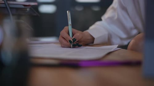 Close Up of Writing on Paper at Desk