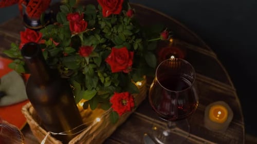 Romantic Table Setting With Wine and Roses