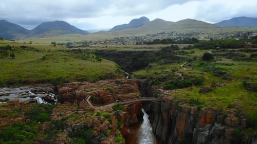 Dramatic Outdoor Landscape View Vivid Scene of River Plunging Into Deep Gorge with Mountains Media