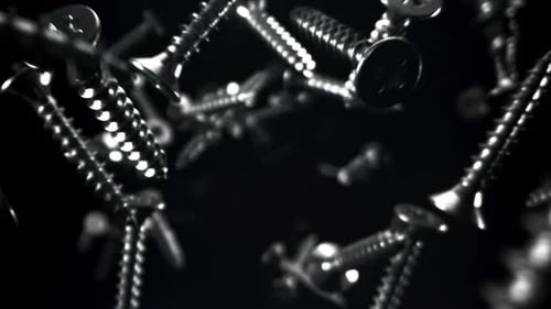 Floating Silver Screws on a Black Background