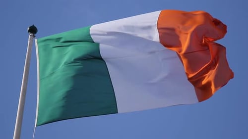 Irish flag waving blowing in the wind in dublin city