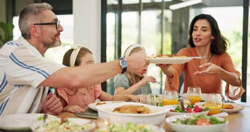Happy family, eating or dishing with food at dinner table for healthy lunch