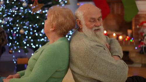 Upset Senior Couple Back to Back at Christmas