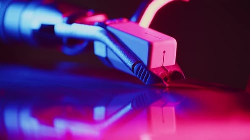 Needle of the Headshell of the Turntable Slides on the Surface of the Record Close Up Until the