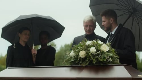 Grieving Diverse People Under Umbrellas Leaving Outdoor Funeral Ceremony