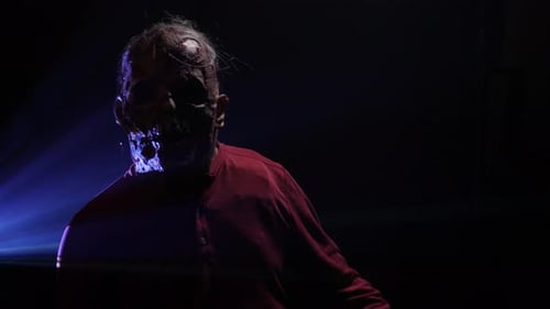 Spooky zombie in a smokey room