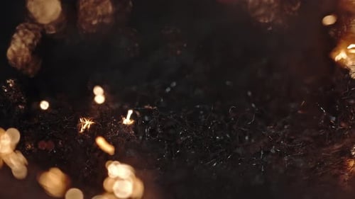Burning embers and glowing fire sparks in a close-up cinematic shot
