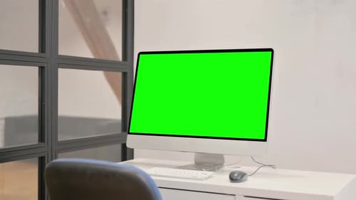 Desktop Computer with Green Screen in Office