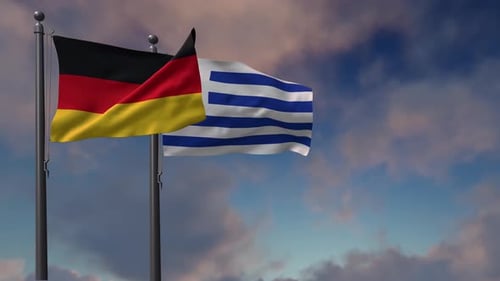Waving Flags of Germany and Greece Against a Cloudy Sky