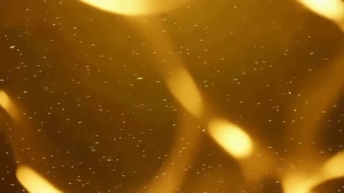 Golden Light Trails and Sparkles Background