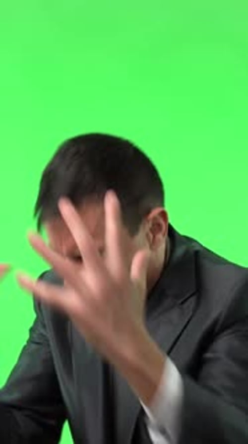 Man in Suit Suffering with Closed Eyes