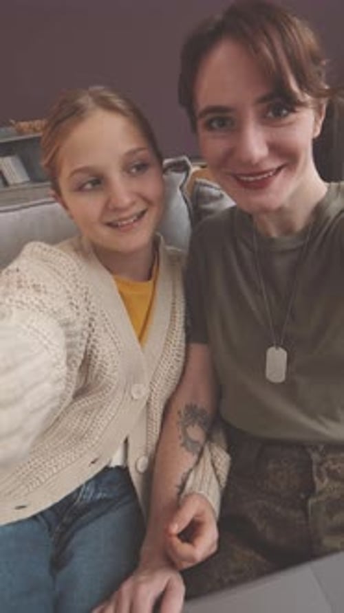 Smiling Young Adult and Child Indoors at Home