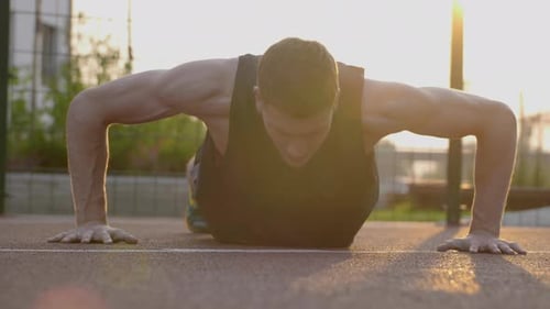Motivational Scene of Workout Outdoor at Urban Area in Evening Sunlights. Man