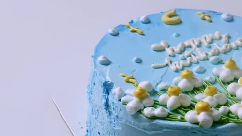 Pan shot of beautifully decorated birthday cake. bakery industry.