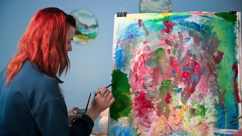 Creative Woman Painting an Abstract Colorful Image