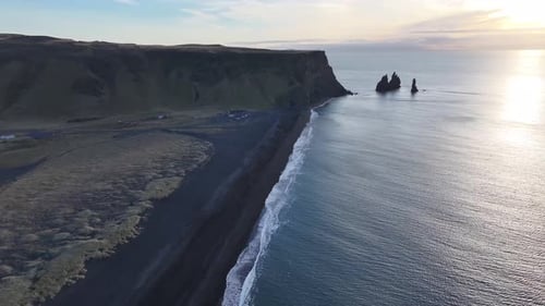 Aerial view of black sand beach and cliffs, Iceland.