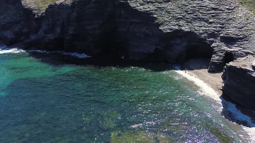 People at the beach aerial drone view playing beach tennis, sunbathing, holiday at the seashore