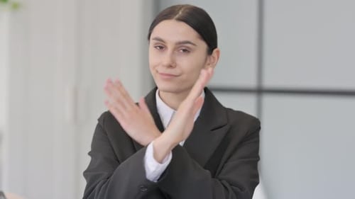 Young Woman Expressing Disagreement in the Workplace