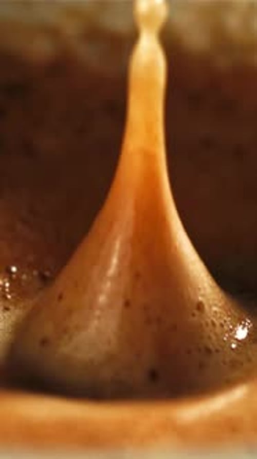 Falling Drop in a Cup of Coffee Filmed on a Highspeed Camera at 1000 Fps
