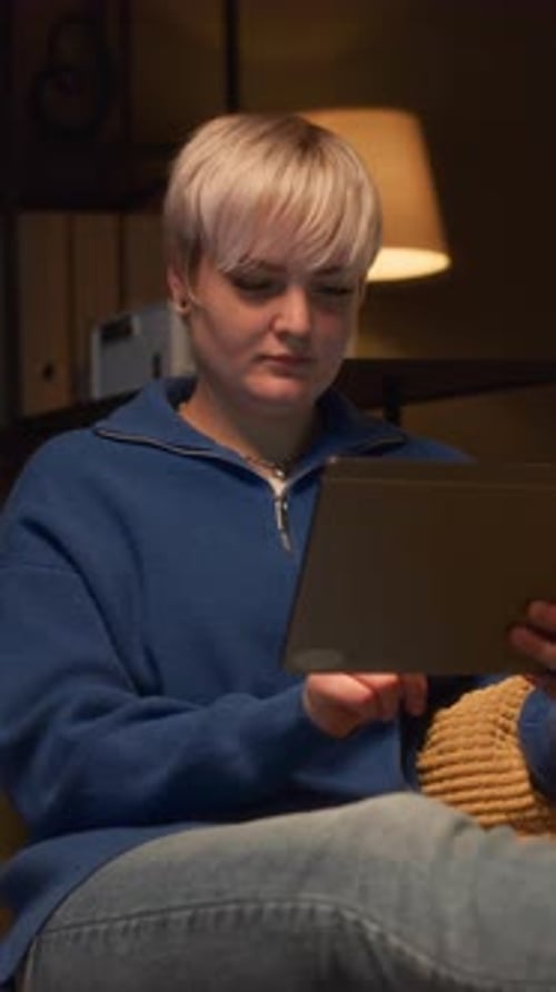 Young Adult Using Tablet Indoors