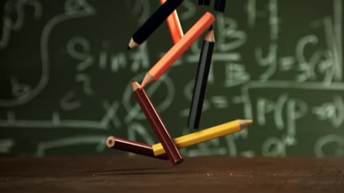 Pencils Fall on the School Desk Filmed on a Highspeed Camera at 1000 Fps