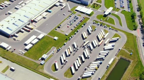 Aerial view of goods warehouse. Logistics center in industrial city zone from above. Aerial view of