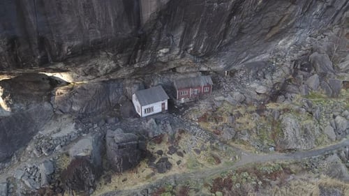 Helleren historical site in Norway. Two old house under cliff