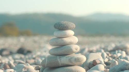 Stone Balance Closeup. Female Hand Making Pebbles Tower From Sea Stones. Macro