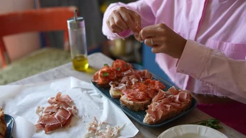 Adult Woman Preparing Meat Appetizers At Home
