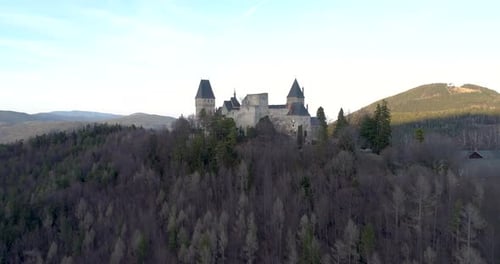 Drone Shot of a Castle on a Hill with a beautiful View at Sunset, 4k UHD