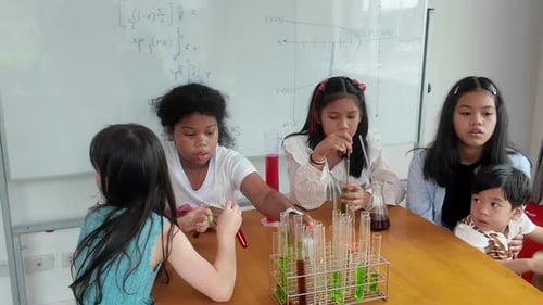 Children Conduct Science Experiment in Classroom