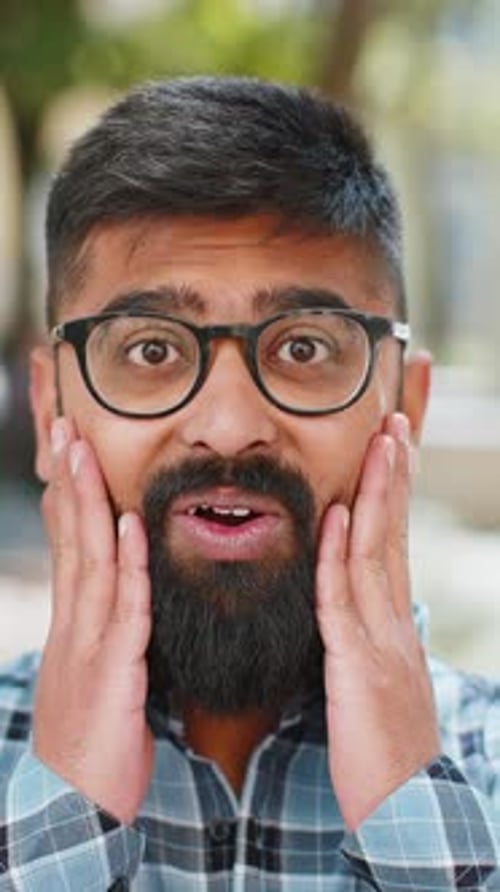 Indian Man Looking Surprised at Camera Shocked By Sudden Win Good Victory News Wow in City Street