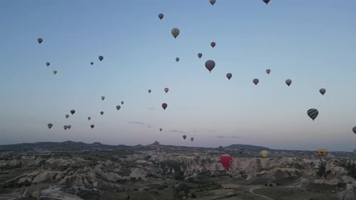 Aerial video over monoliths in Cappadocia, on hot air balloons, Turkey