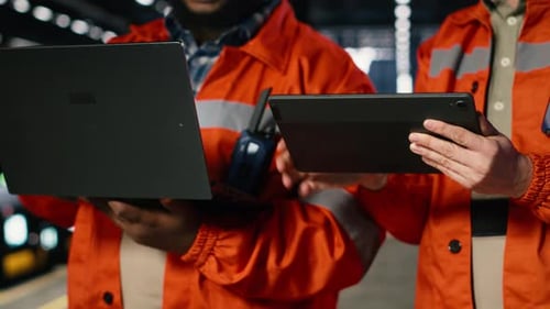 Engineers Team Coordinates Strong Labor in Industry Plant with Gadgets