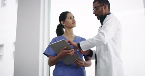 Doctor, nurse and tablet in hospital, clinic or healthcare research, advice