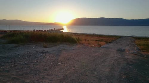 4k Aerial shot of the sunset over the lake, river, beach, sea
