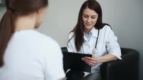 Patient have mental breakdown and crying. Woman have a consultation in clinic with female doctor