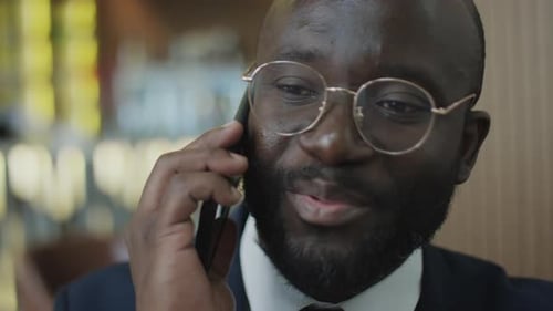 Man in Suit Talking on Cell Phone Close Up