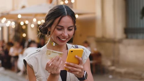 Young Woman Using Credit Bank Card Smartphone While Transferring Money Purchases Online Shopping