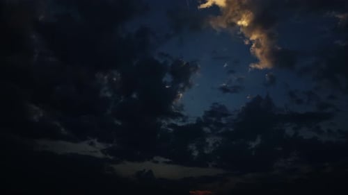 Dramatic Clouds at Sunrise with Golden Sunlight